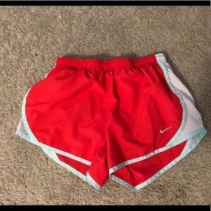 Red and teal Nike shorts